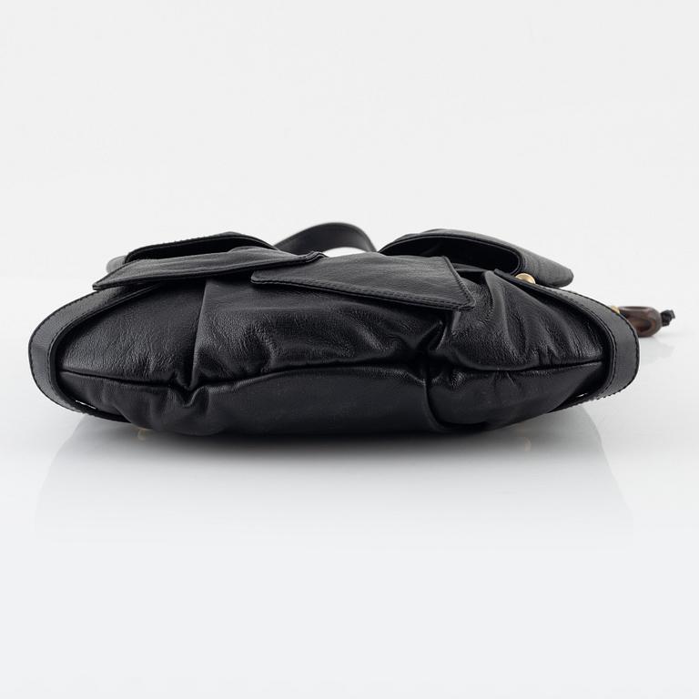 Yves Saint Laurent, a black leather bow bag.