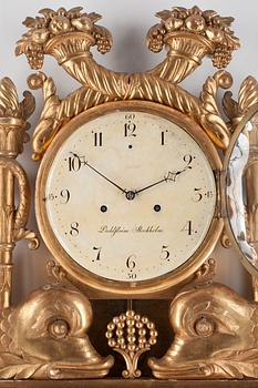 A Swedish Empire early 19th century gilt wood wall clock by I. Dahlström.