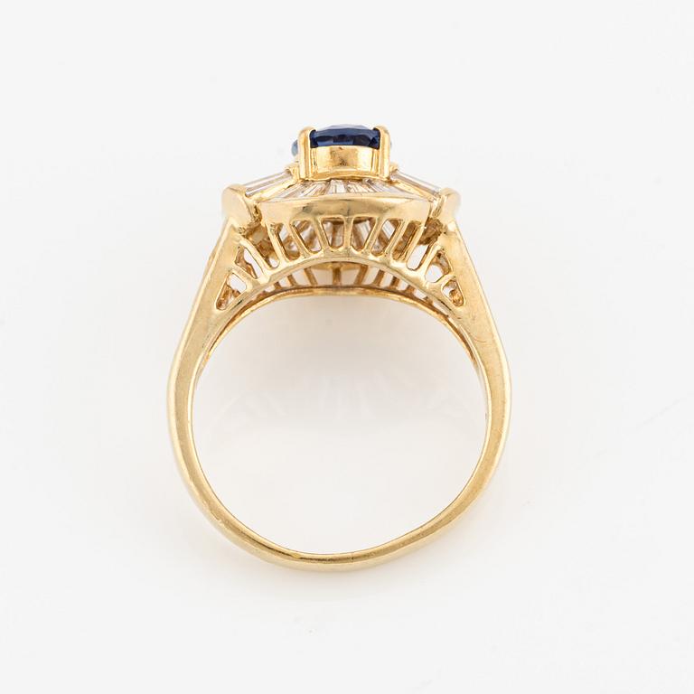 Ring, 18K gold with sapphire and baguette-cut diamonds.