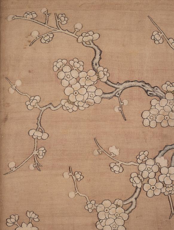 A bolt of creme coloured silk fabric, a framed textile and two embroidered silk panels, Qing dynasty.