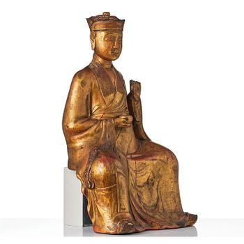 A large gilt lacquer figure of a deity, Vietnam, 19th century.