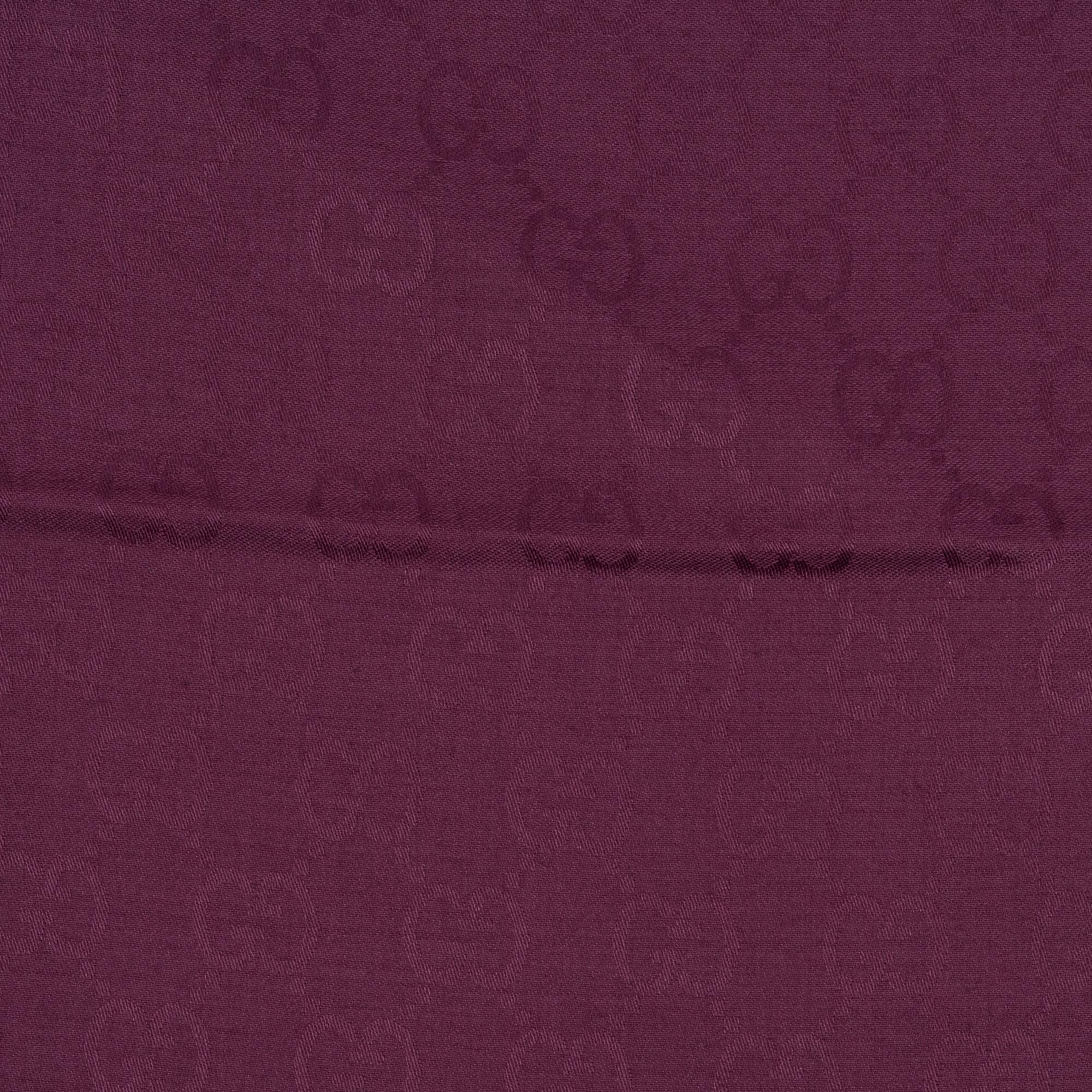 Gucci, a wool and silk mix "GG" jaquard shawl.
