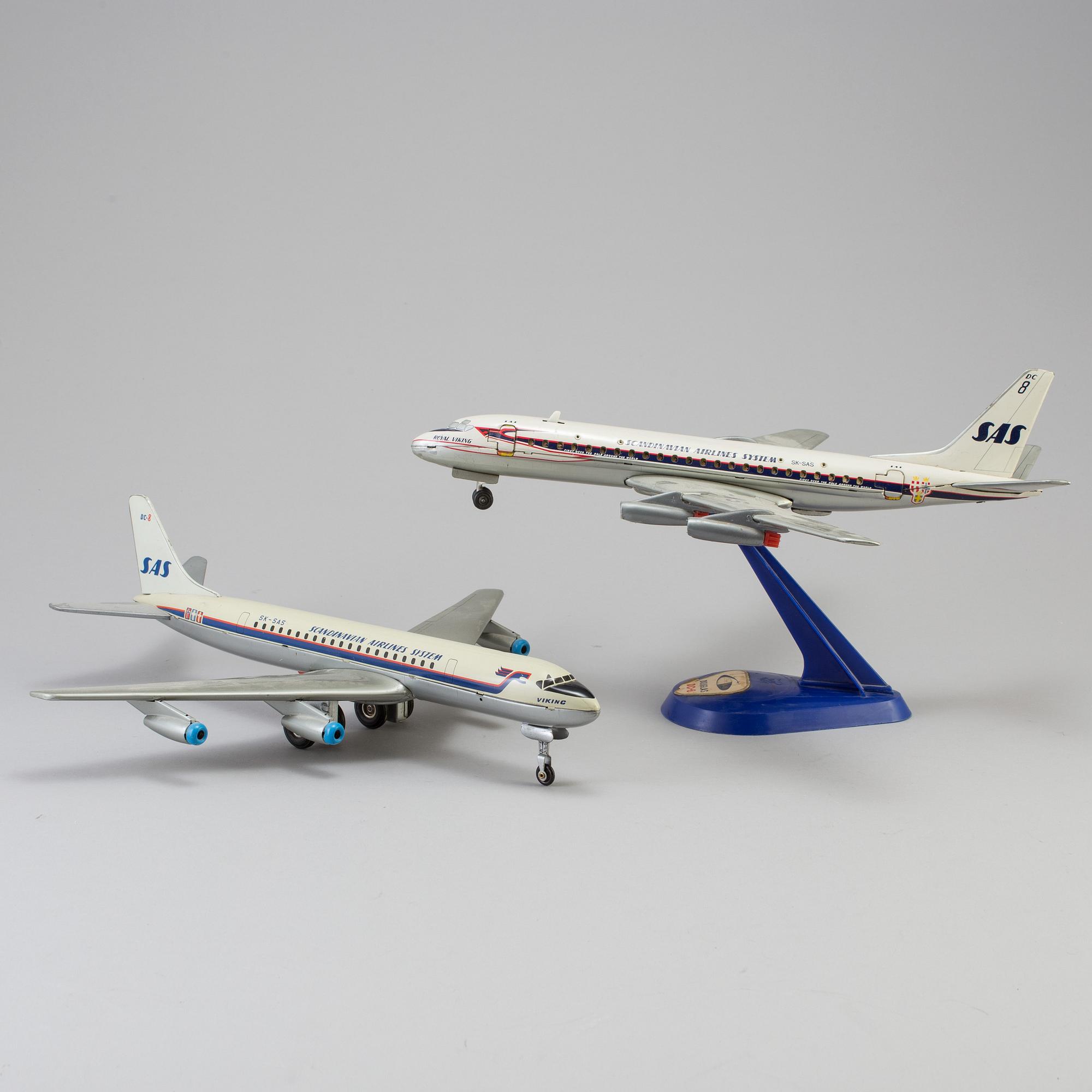 Two tinplate toy planes by Tomiyama and Arnold, Japan and Germany, 1960s.