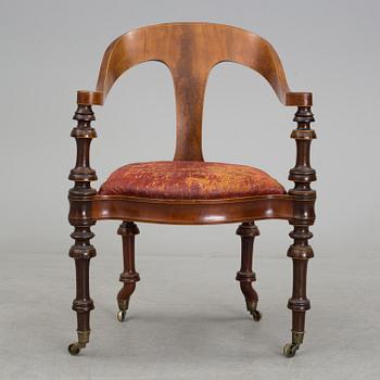 A mid 19th century writing desk and chair.