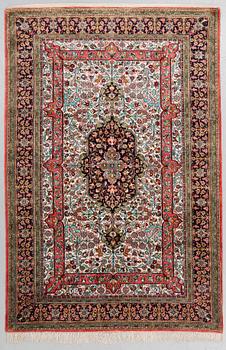 A RUG, old Silk Qum, around 203 x 133 cm.