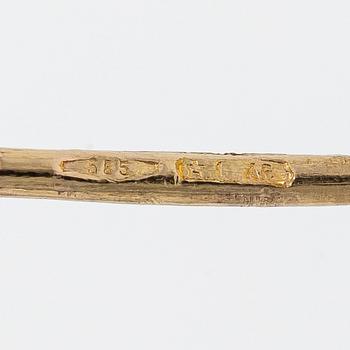 A pair of 14K gold earrings.