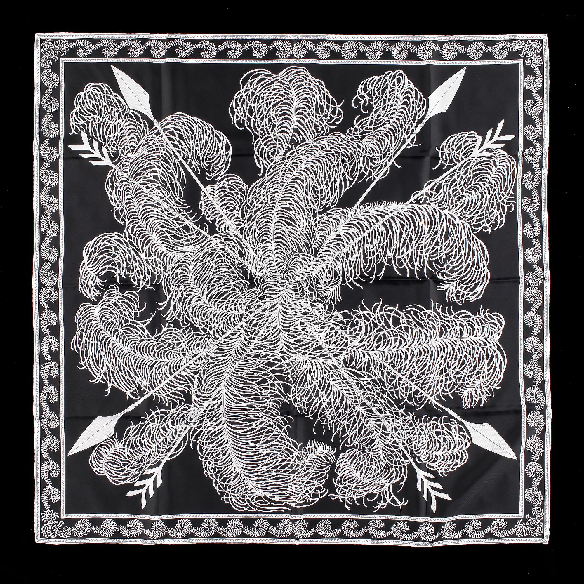A set of three scarves by Christian Dior, Emilio Pucci and Yves Saint Laurent.