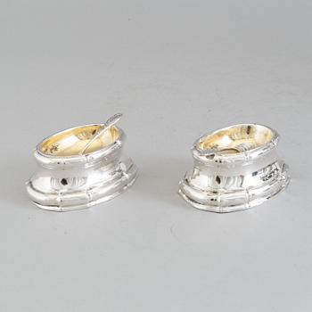 A pair of Rococo silver salt cellars, 18th Century.