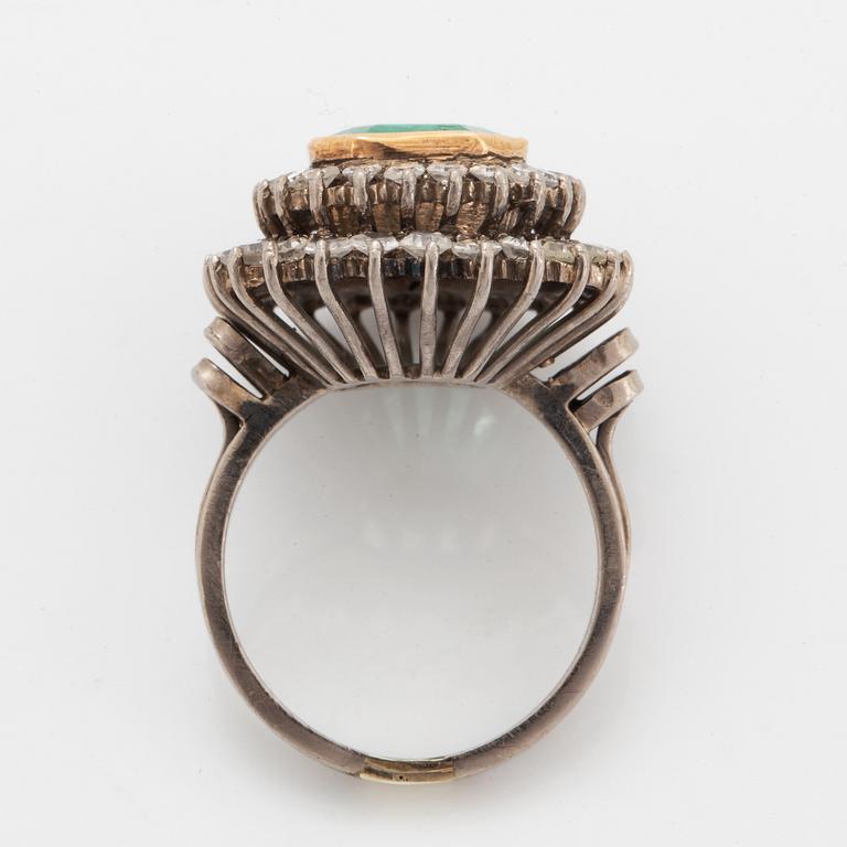 Emerald-cut emerald and eight-cut diamond ring.