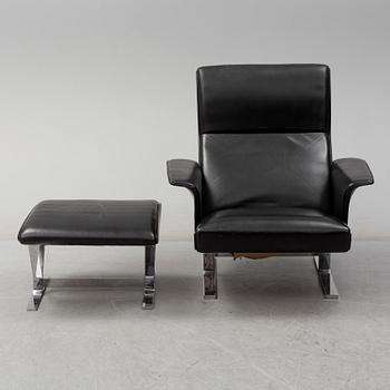 A second half of the 20th century easy chair and stool by Georg Thams, Vejens Polstermöbelfabrik, Denmark.