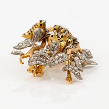 A W.A. Bolin brooch in 18K gold with enamel details and rose-cut diamonds.