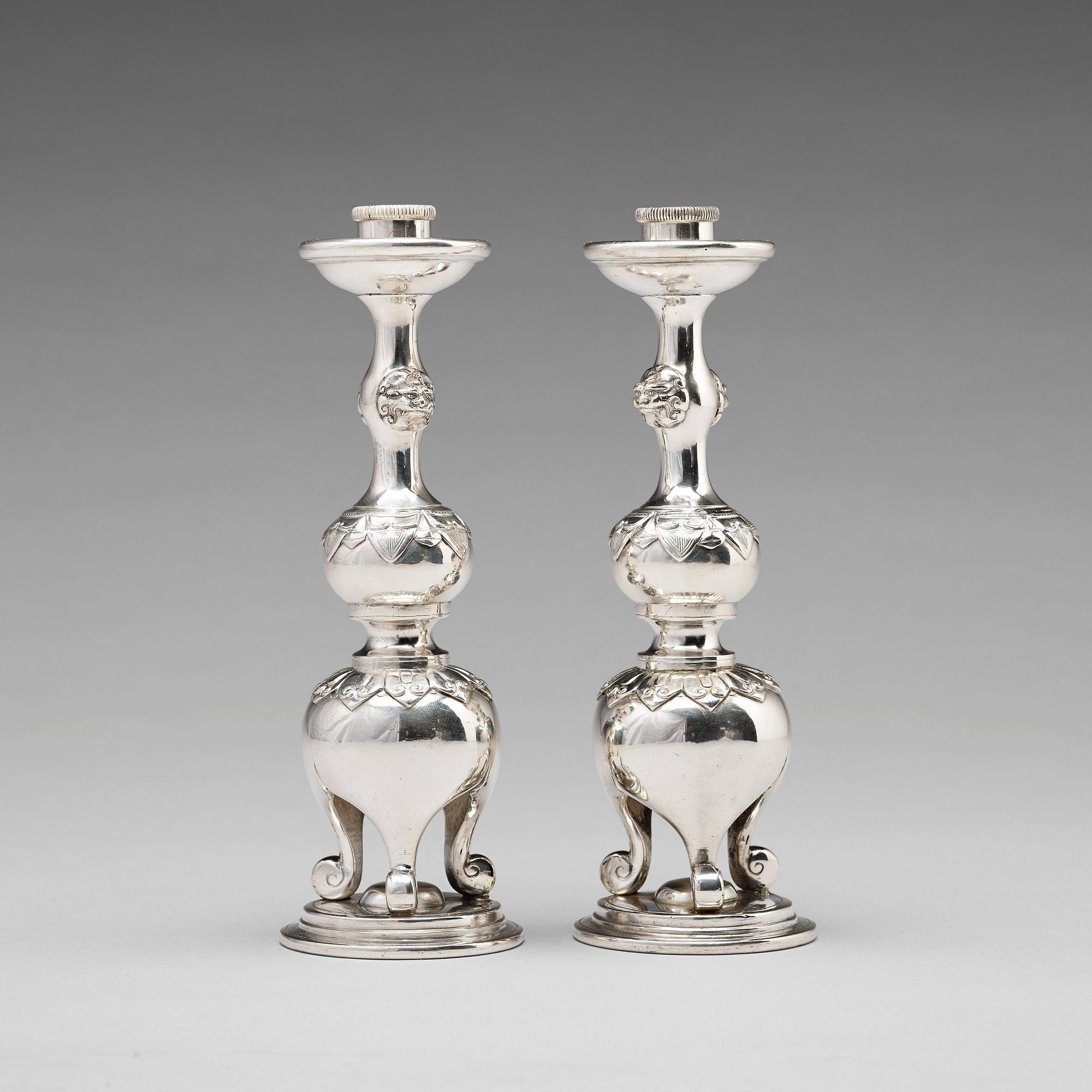 A pair of Chinese silver candle sticks, Shanghai, early 20th Century.