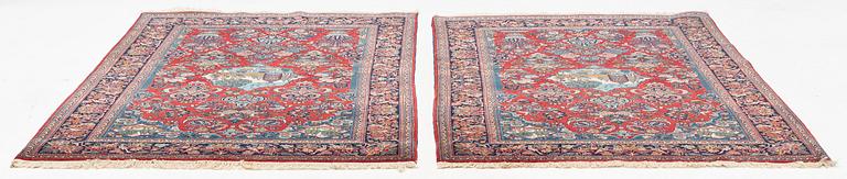 A pair of semi-antique pictoral Kashan rugs, ca 200 x 130 and 197 x 128 cm.