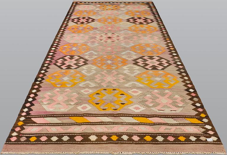 A kurdish kilim, ca 430 x 155 cm.