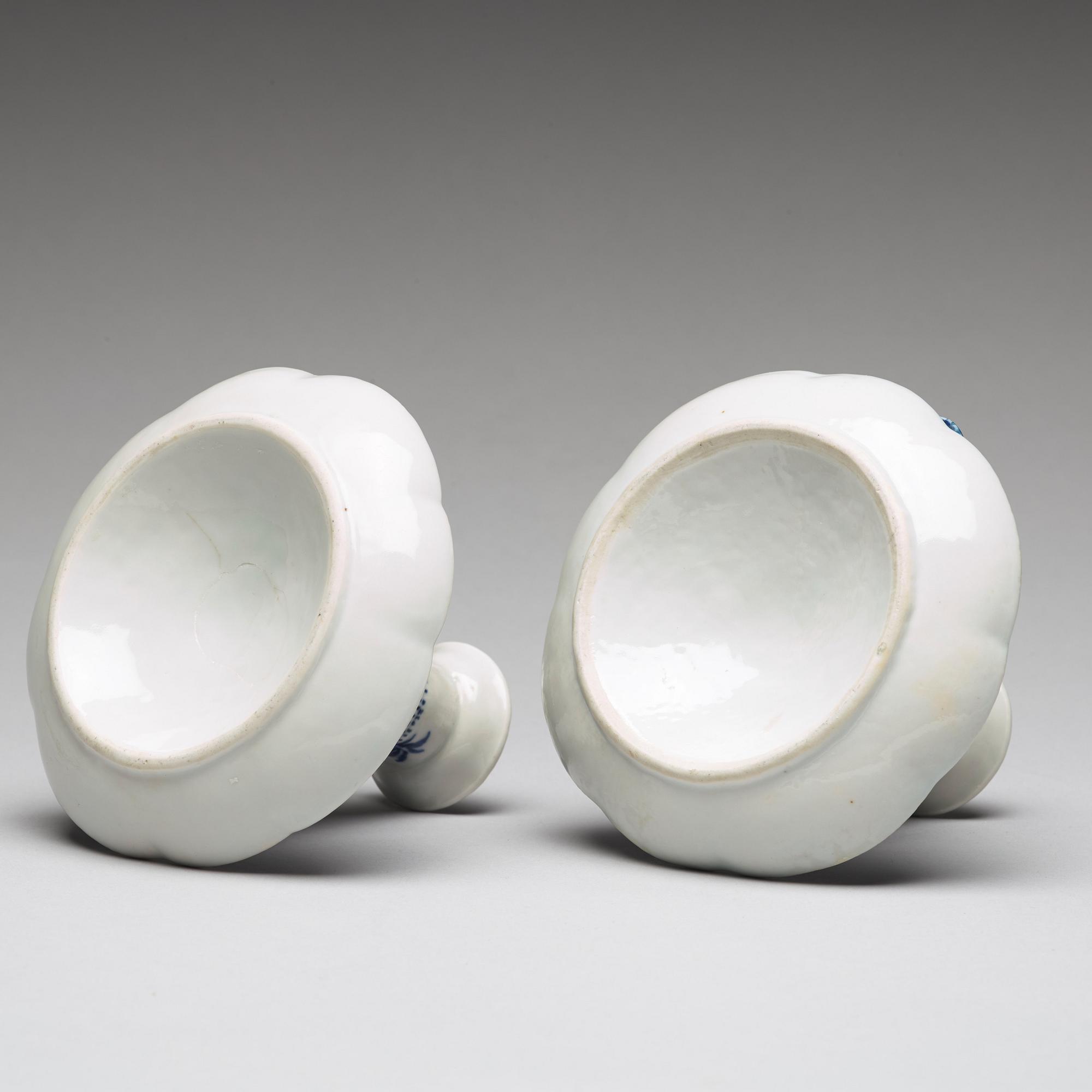 A pair of blue and white candle sticks, Qing dynasty, Qianlong (1736-95).