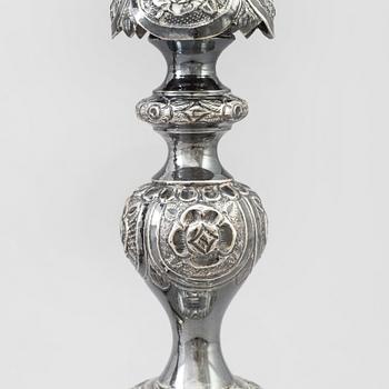 A pair of silver Sabbath candlesticks, Maker M. Sztern, Warsaw, Poland. Assayer Josef Sosnkowski, 1864. Weight 833 g.