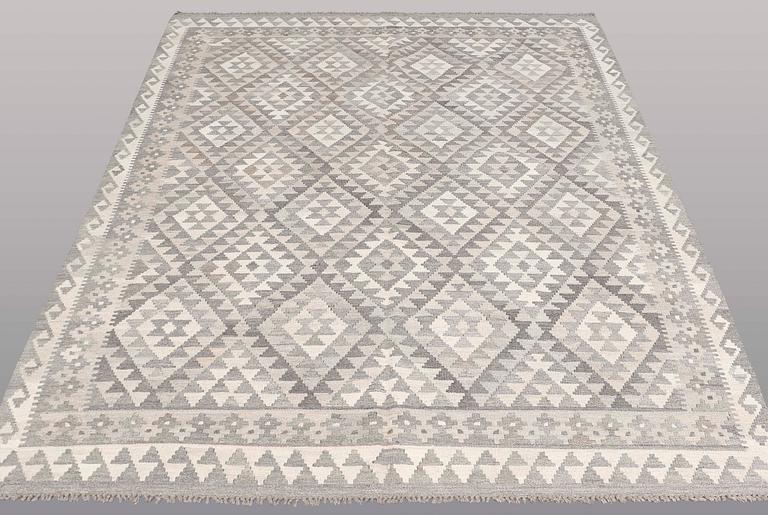 A CARPET, Kilim, ca 242 x 178 cm.