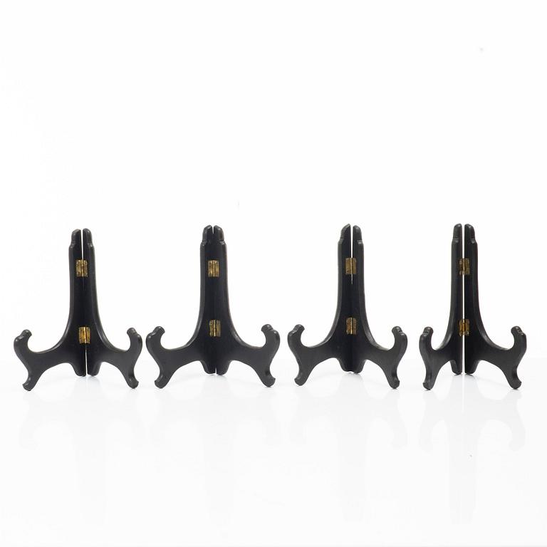 A group lot of 13 Chinese wooden stands, 20th century.