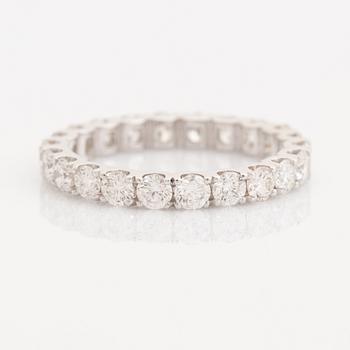 Brilliant-cut diamond eternity ring.