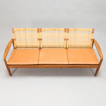 Hans Olsen, A teak and rattan sofa for Juul Kristensen, Denmark, late 1950s.