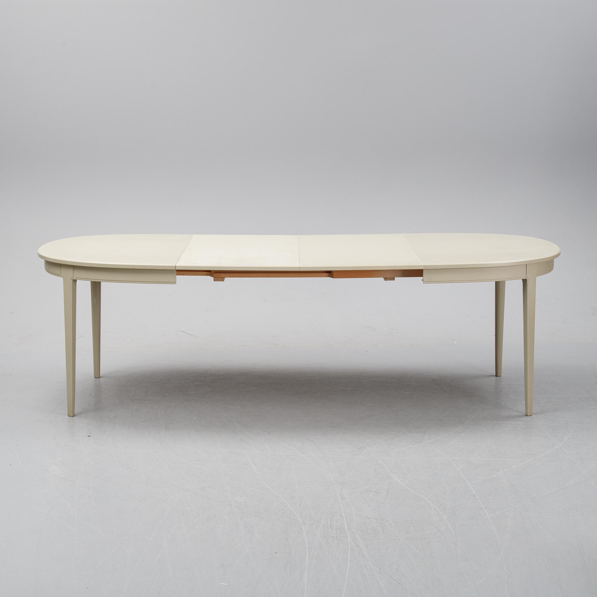 A dining table with two armchairs and six chairs by Carl Malmsten for Bodafors.