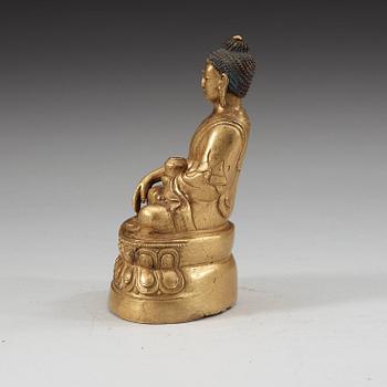 A gilt bronze Sakyamuni Buddha, Tibet, late 19th century.