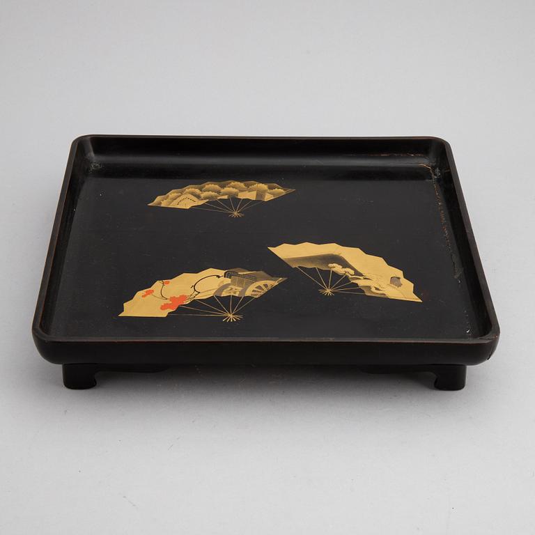 Two Japanese red and black hiramakie lacquer trays, first half of the 20th century.