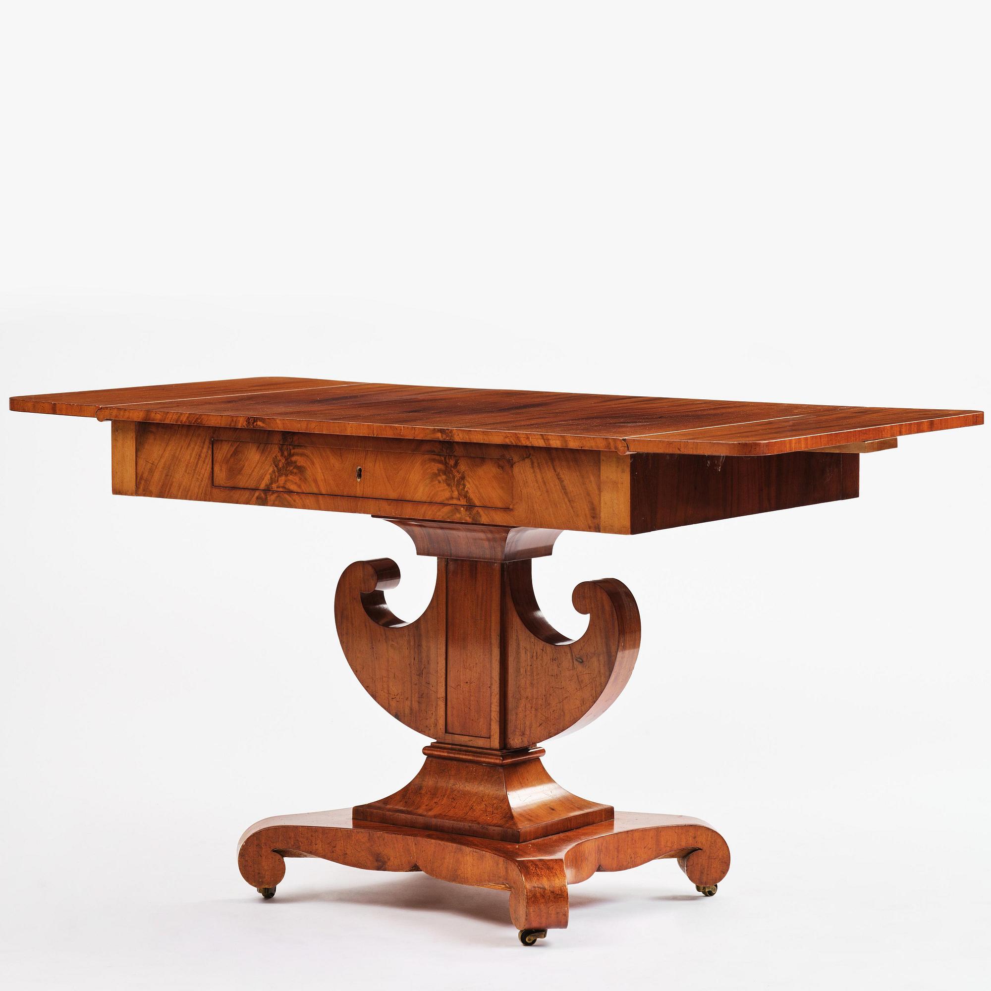 A Swedish Empire mahogany center table.