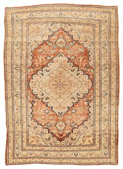 An antique Tabriz rug, ca 174 x 125 cm.