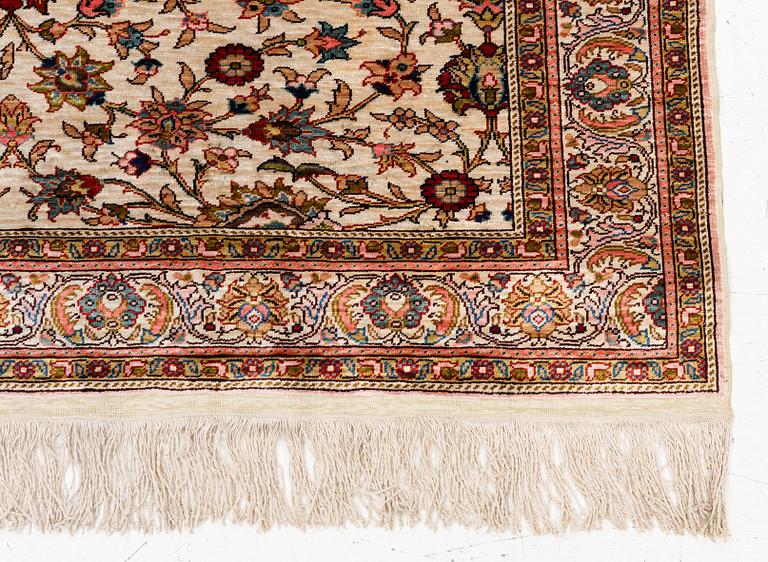 An Oriental silk rug, c. 122 x 76 cm.
