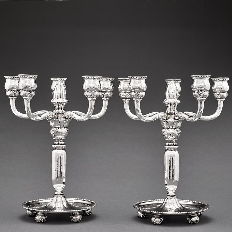 Georg Jensen, a pair of 830/1000 silver five light candelabra, Copenhagen 1920, design nr 200.