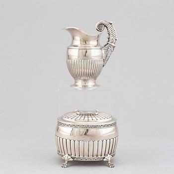A silver creamer by Johan Petter Ahlforss, Strängnäs, 1833 and a silver sugar box, Kristianstad, 1928.