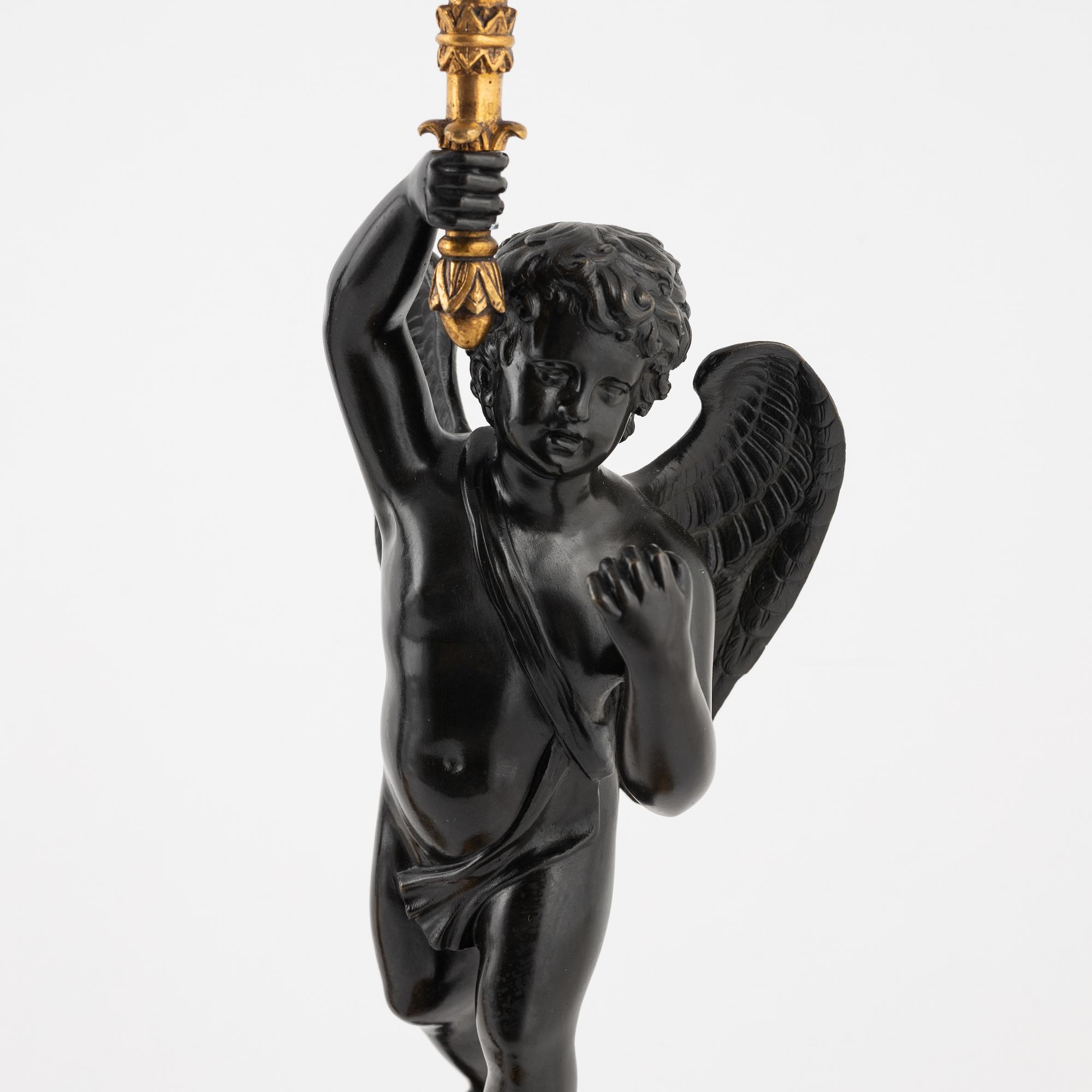 A pair of Empire-style ormolu and marble four-light candelabra, late 19th century.