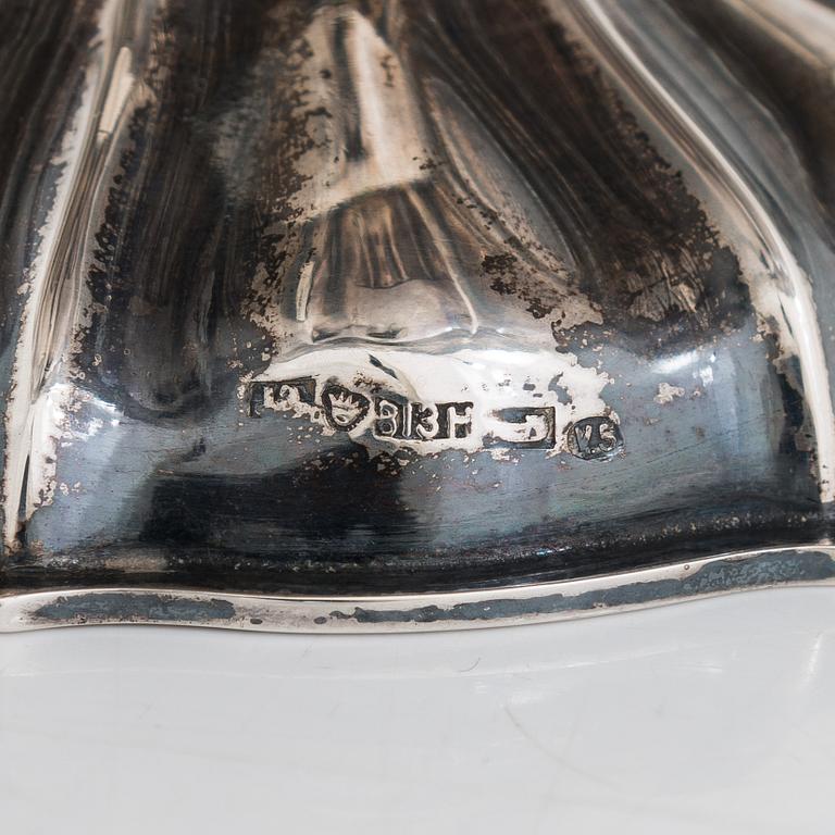 A sweetmeat basket and a 12-piece set of silver coasters, Helsinki and Hämeenlinna, 1920s and 1930s.