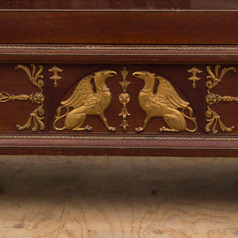 A mahogany veneered Empire style cabinet, circa 1900.