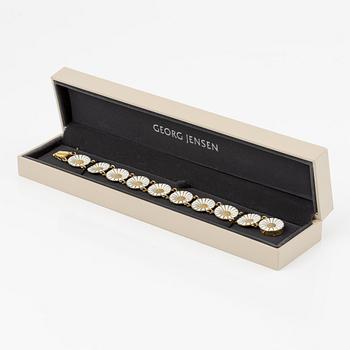 Georg Jensen and A Michelsen "Daisy" a bracelet, a pendant, and a brooch silver gilt and enamel.