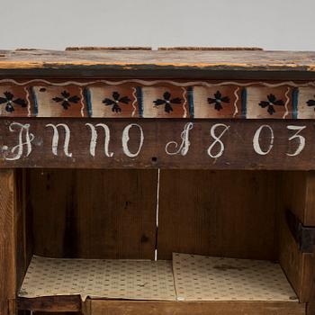 An early 19th century wall cabinet.