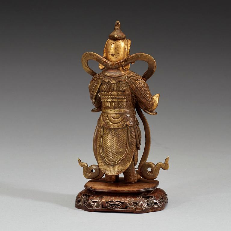 A gilt bronze figure of a Lokapala, Qing dynasty, 19th Century.