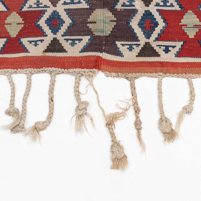 An antique Anatolian kilim, ca 324 x 169 cm.