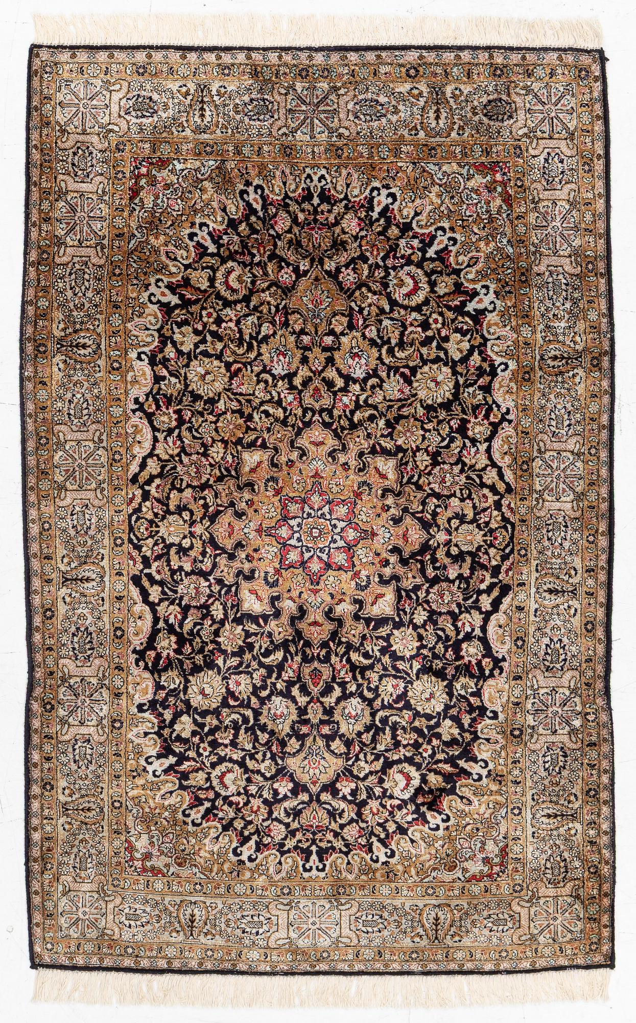 A Ghom, silk rug, c. 162 x 102 cm.