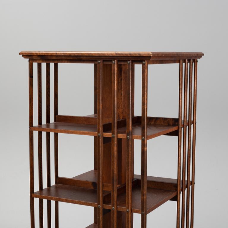 A 21st Century oak revolving bookcase.