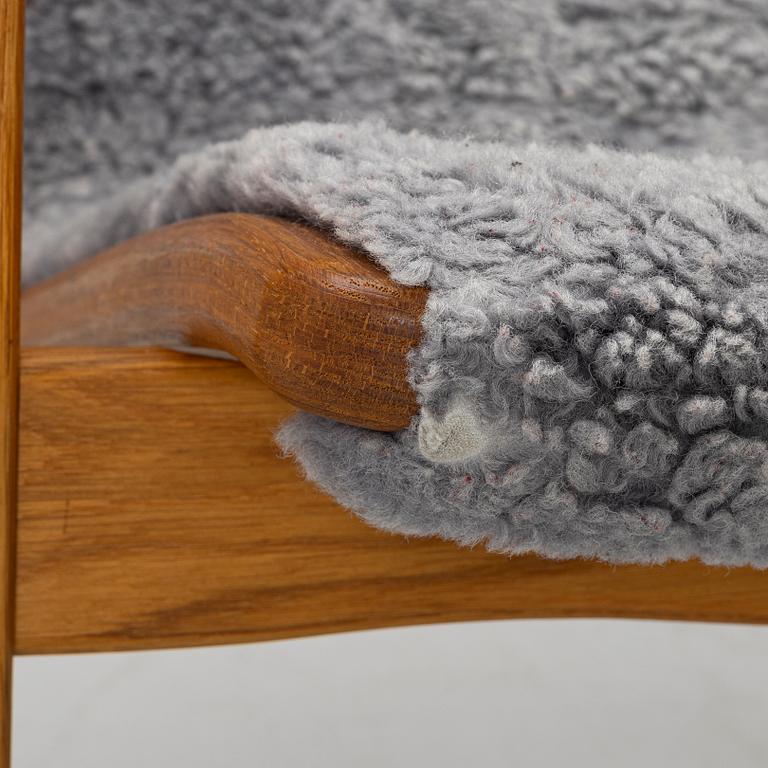 Yngve Ekström, A pair of armchairs, a footstool, “Lamino”, and a side table, Swedese, 2000s.
