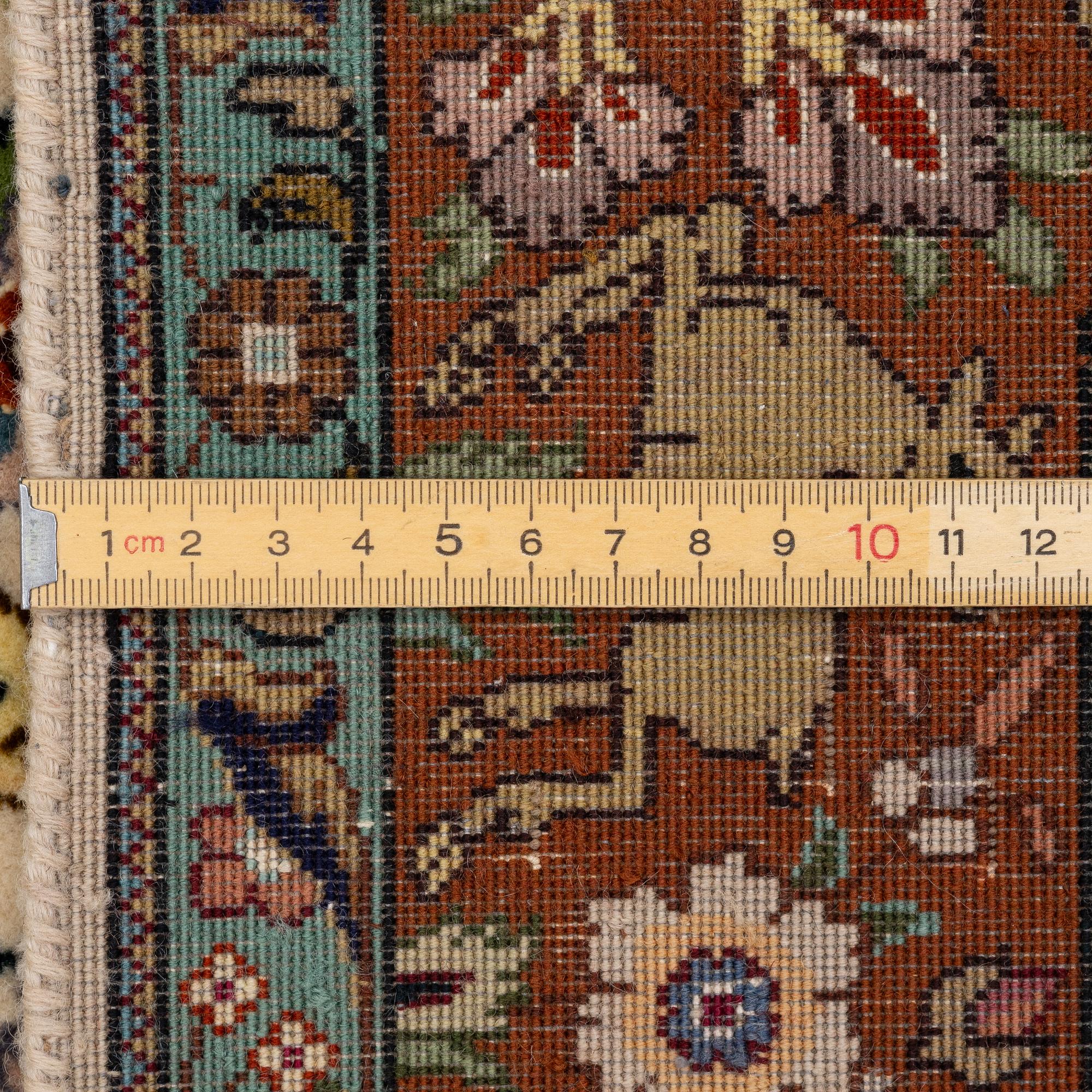 A Tabriz part silk rug, c. 145 x 100 cm.