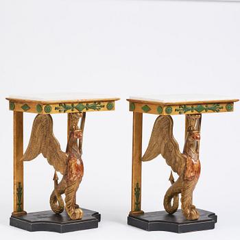 A pair of giltwood console tables, Empire-style incorporating older elements.