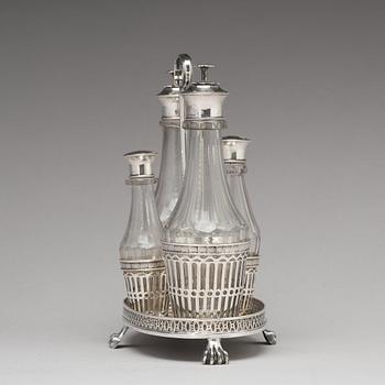 A Swedish early 19th century silver and glass cruet-set, marked Pehr Zethelius, Stockholm 1808.