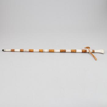 A Sami reindeer horn and birch walking stick, signed.