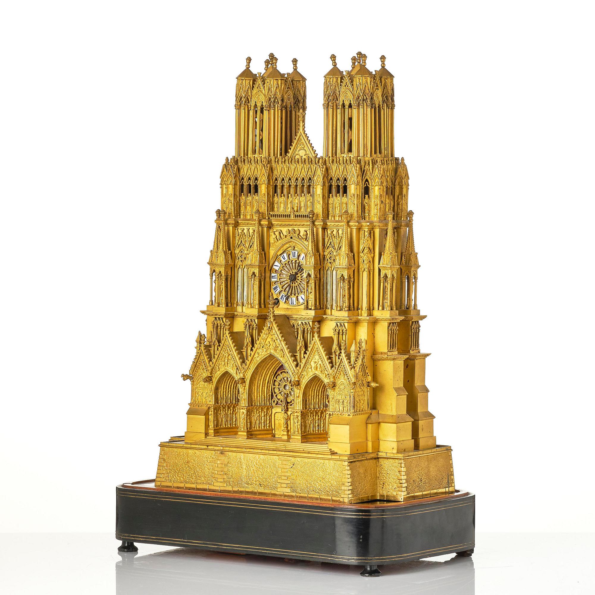 A Charles X ormolu mantel clock modelled as the Cathedral of Reims, Paris, 1820's.