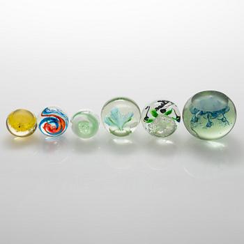 Six late 20th century paperweights.