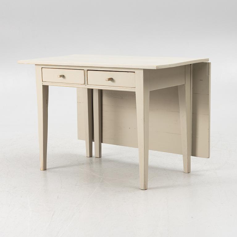 A drop-leaf table, late 19th century.