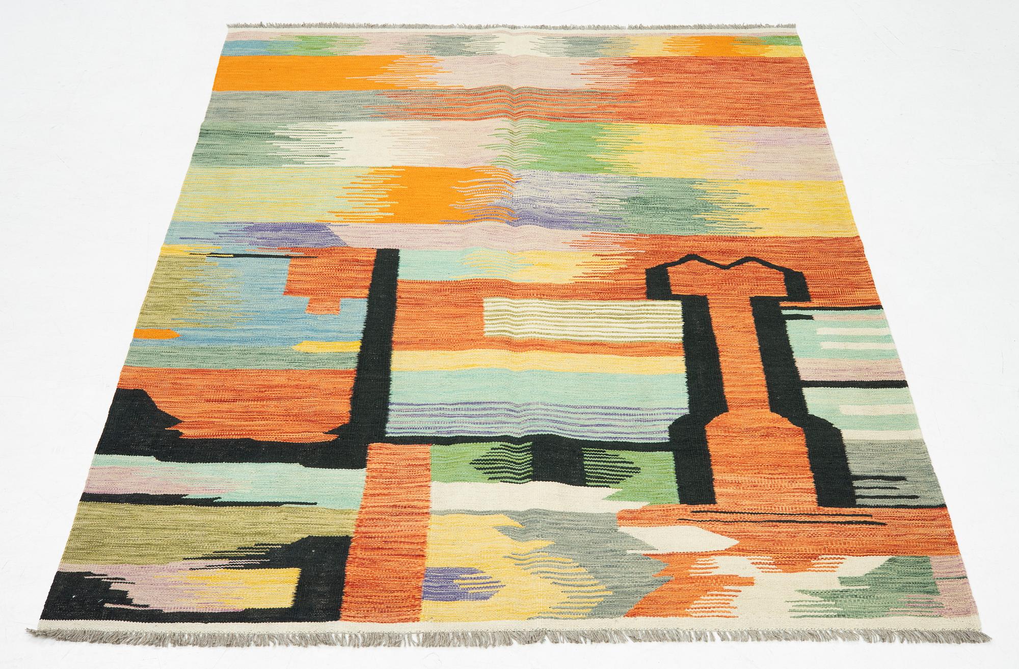 A kilim rug, 247 x 170 cm.